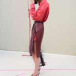 Givenchy Summer 2027 runway look with red shirt and leather skirt