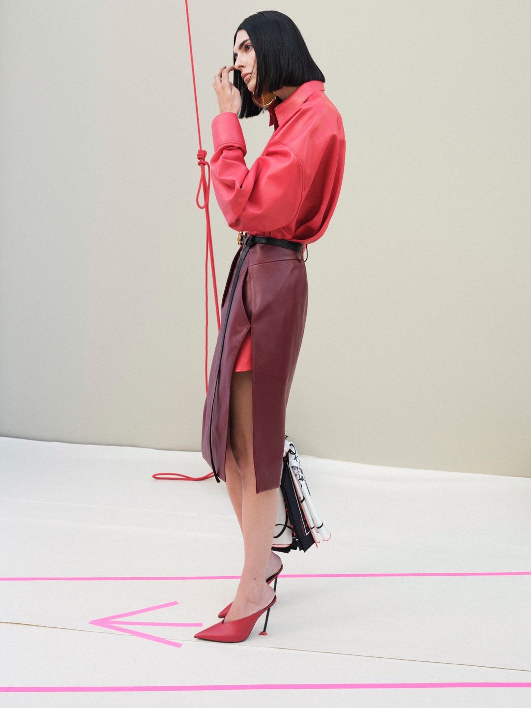 Givenchy Summer 2027 runway look with red shirt and leather skirt