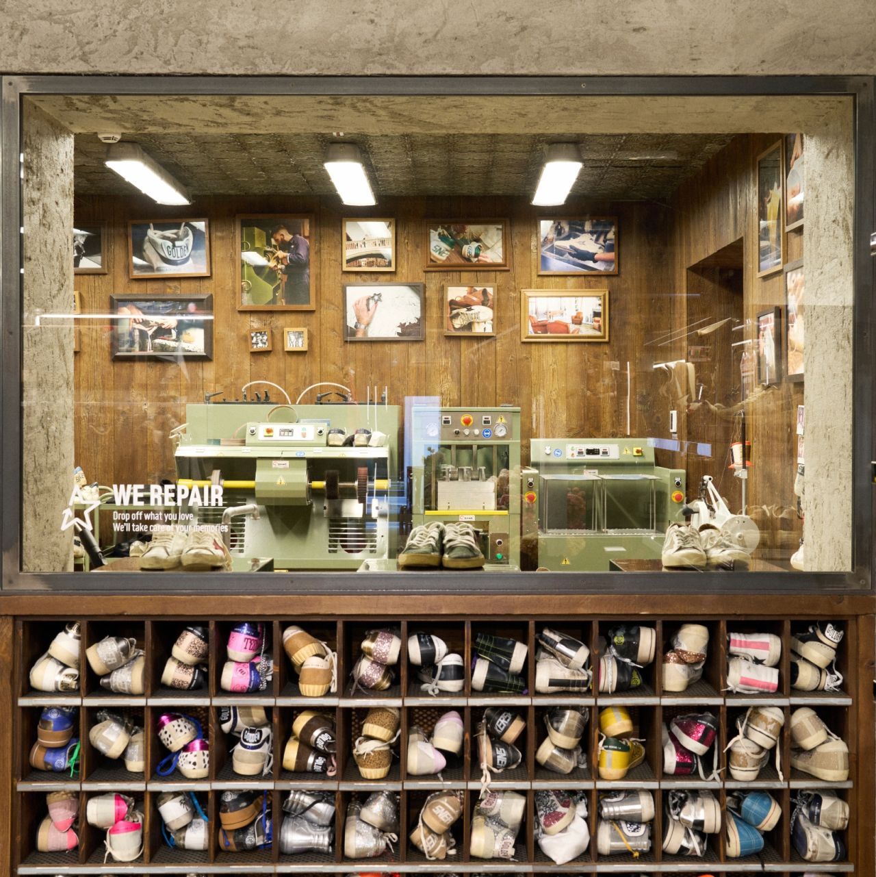 Golden Goose in-store workbench behind a display of sneakers