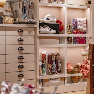 Accessories, shoes and small leather goods displayed on Golden Goose shelving