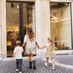 Family approaching the Golden Goose Kids store in Rome's Piazza del Popolo