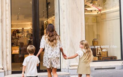 Family approaching the Golden Goose Kids store in Rome's Piazza del Popolo
