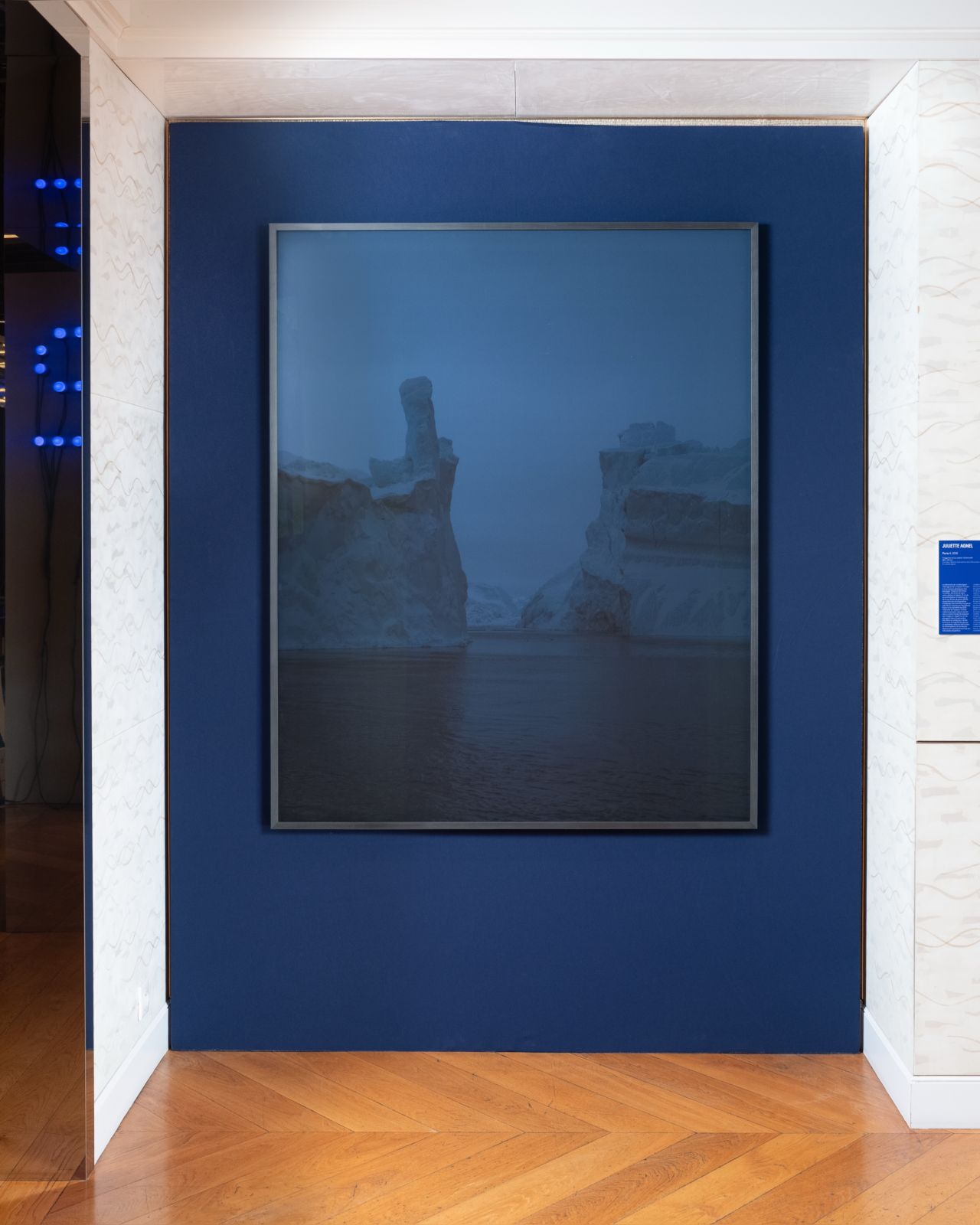 Blue-toned framed work in the Guerlain exhibition