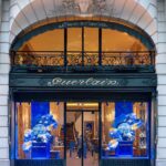 Guerlain's 68 Avenue des Champs-Élysées flagship with blue L’Heure Bleue window displays