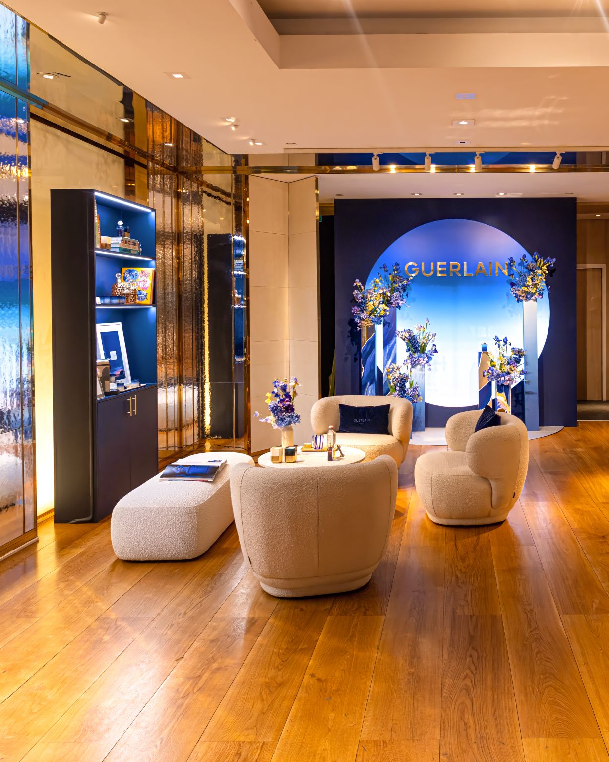 Seating and L’Heure Bleue display inside Guerlain's Champs-Élysées flagship