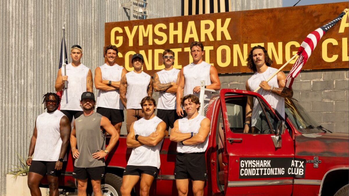 Participants beside Gymshark Conditioning Club branding and a red vehicle in Austin