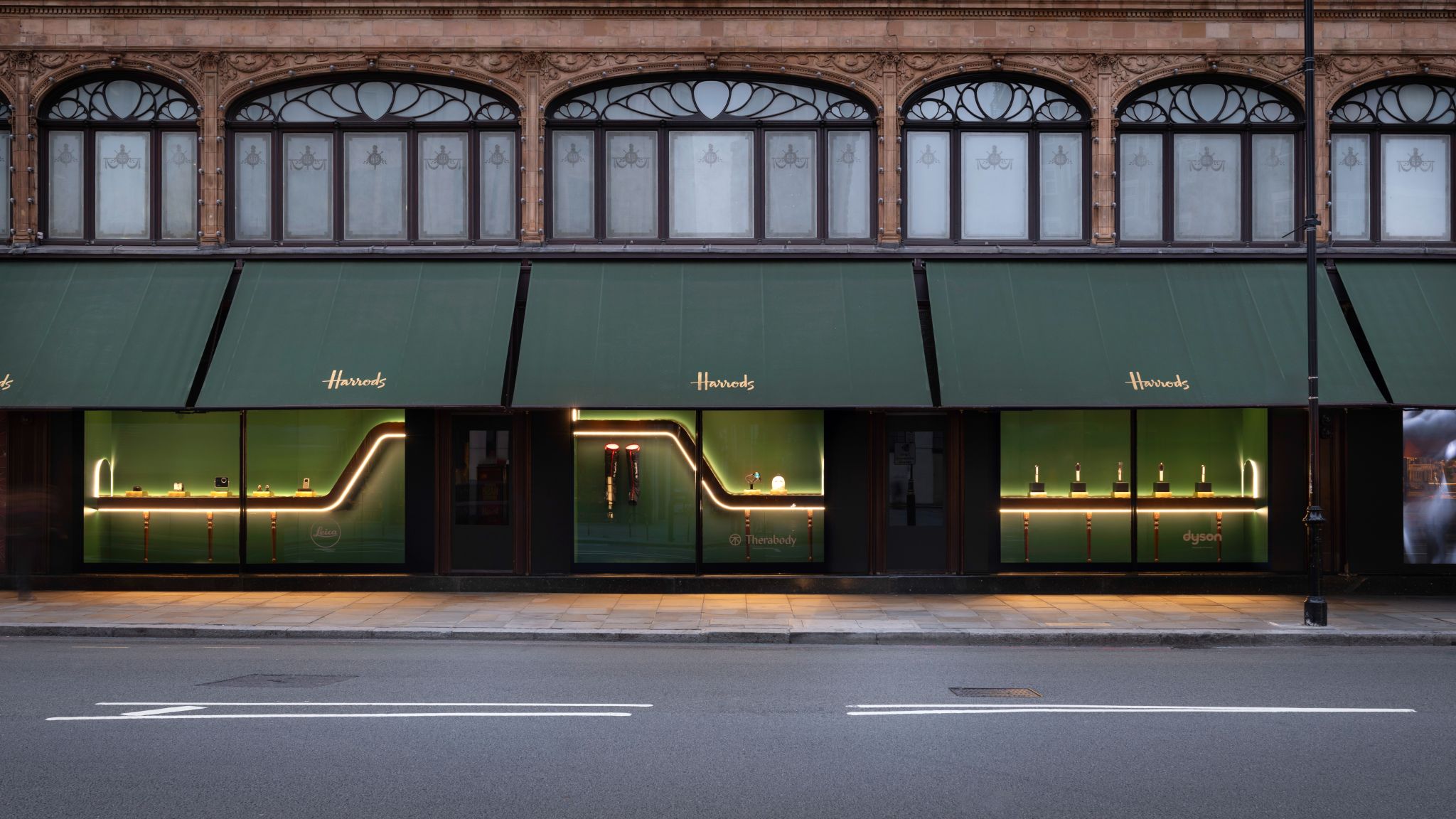 Harrods Technology Month green window display with walnut-finished conveyor ribbon, photograph 1