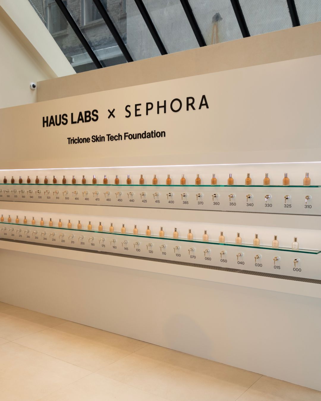 Complexion products arranged by shade inside the Haus Labs pop-up
