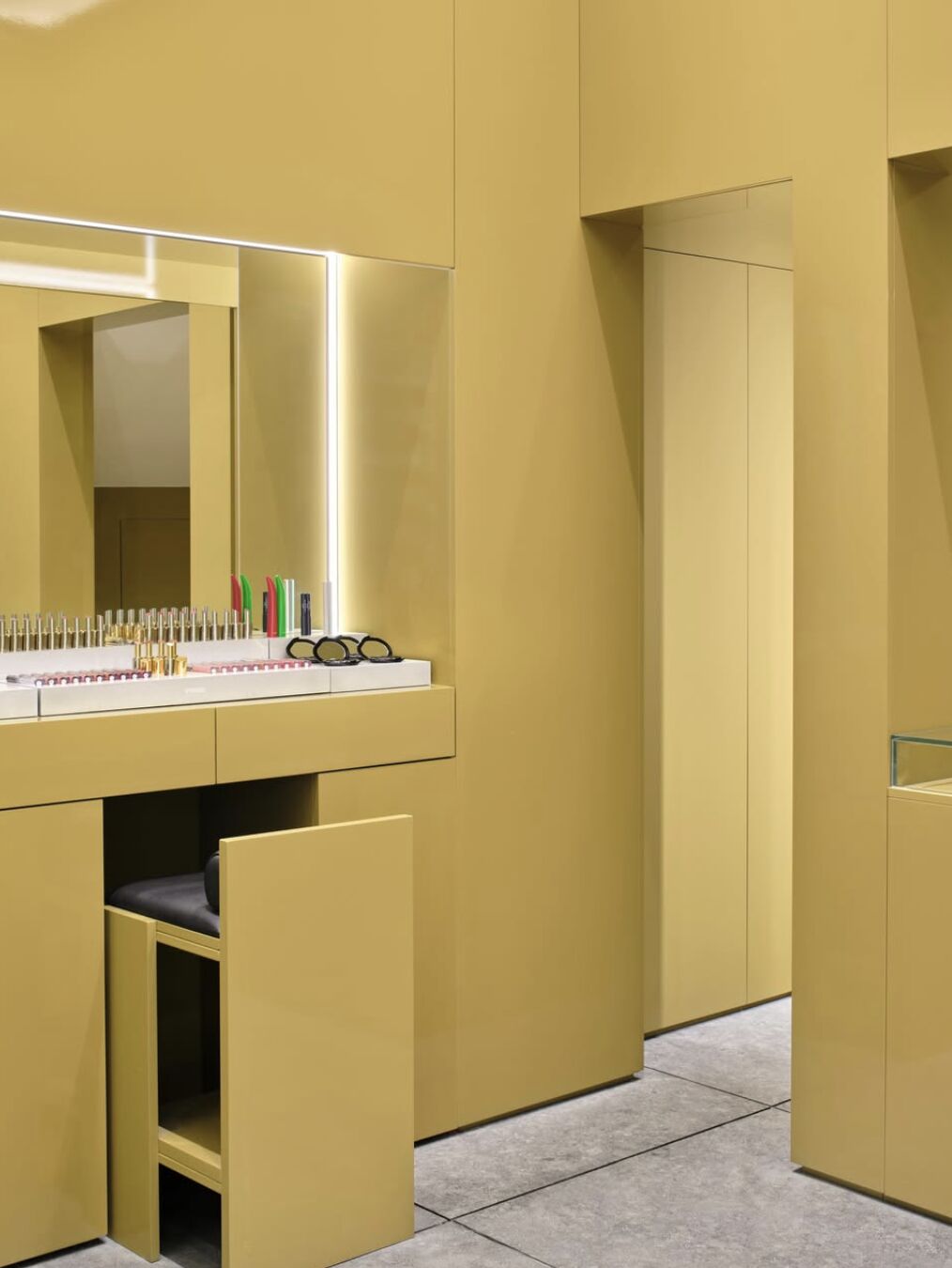 Mustard-yellow makeup consultation area inside Byredo's Leeds boutique
