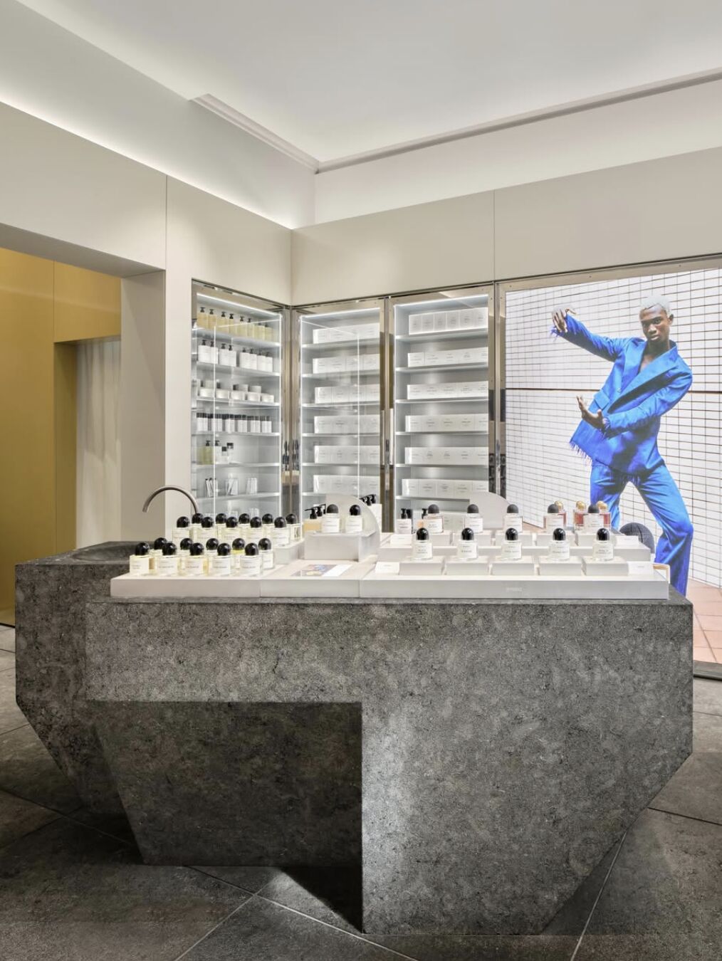 Stone display island and fragrance shelves inside Byredo's Leeds boutique