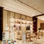 Library and seating area beneath restored decorative ceilings at Casa Cucinelli Shanghai.