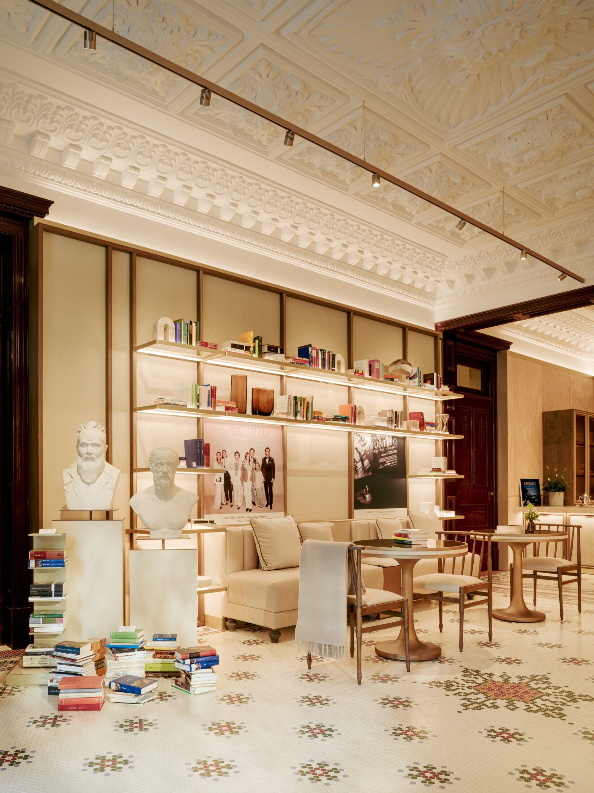 Library and seating area beneath restored decorative ceilings at Casa Cucinelli Shanghai.