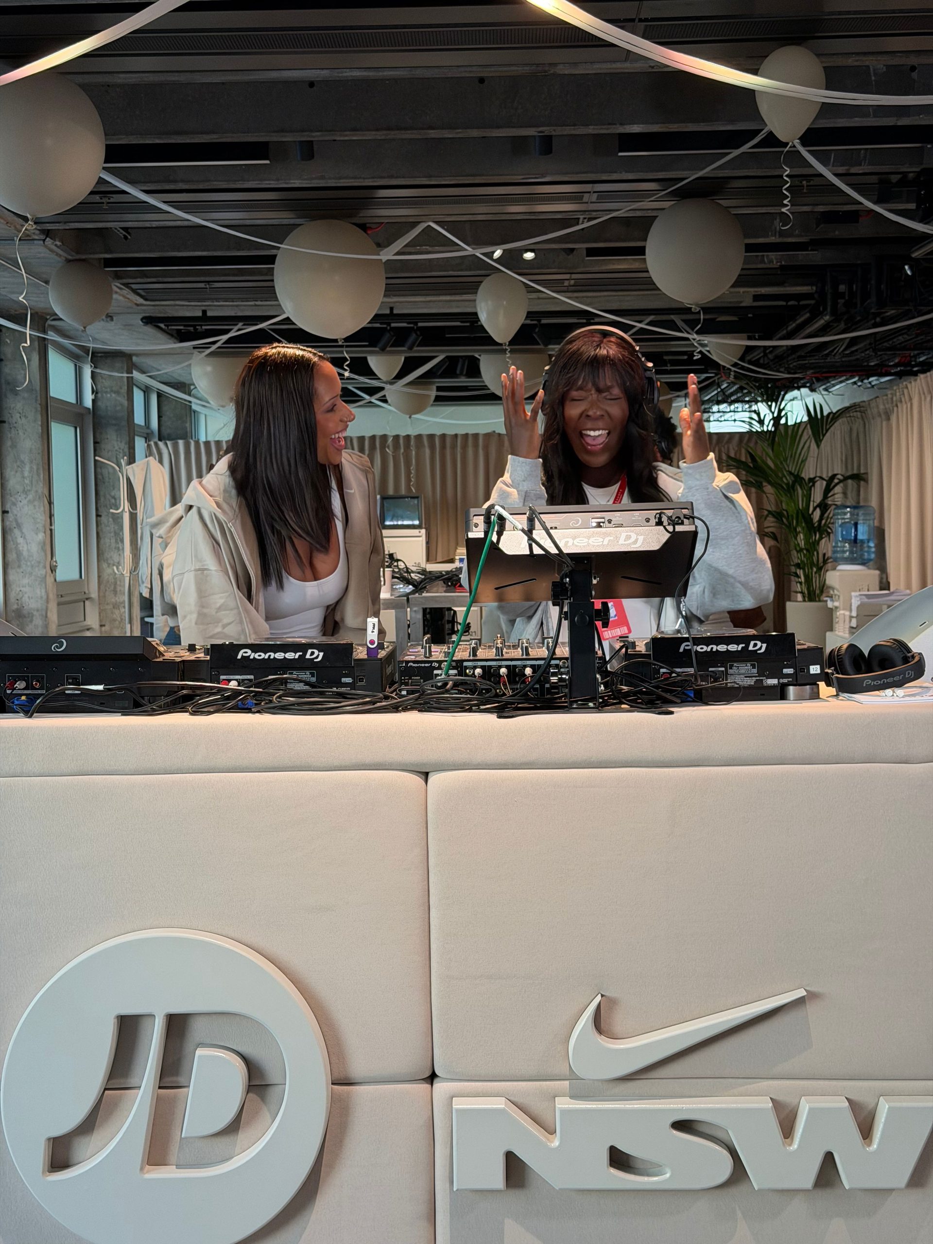 Two DJs at the Studio Fleece activation