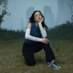 JISOO in Salomon's IN THE OPEN campaign in a misty Seoul landscape