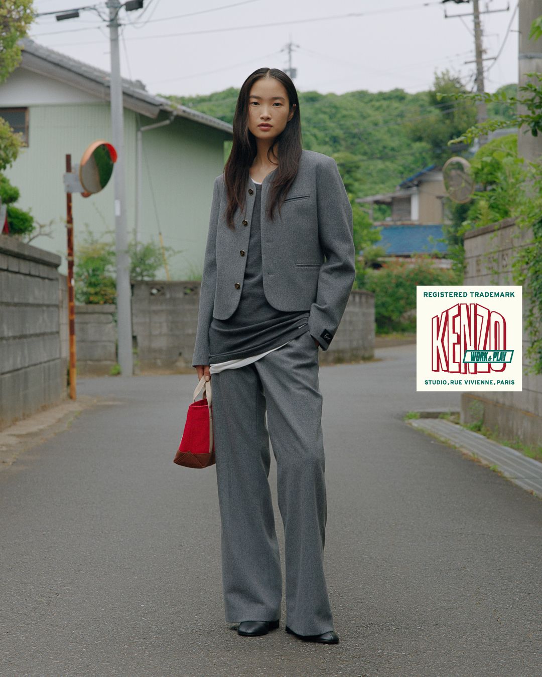 Model wears grey KENZO tailoring on a street in Chiba