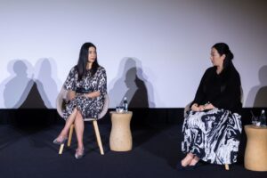Two participants in conversation on the Women In Motion stage