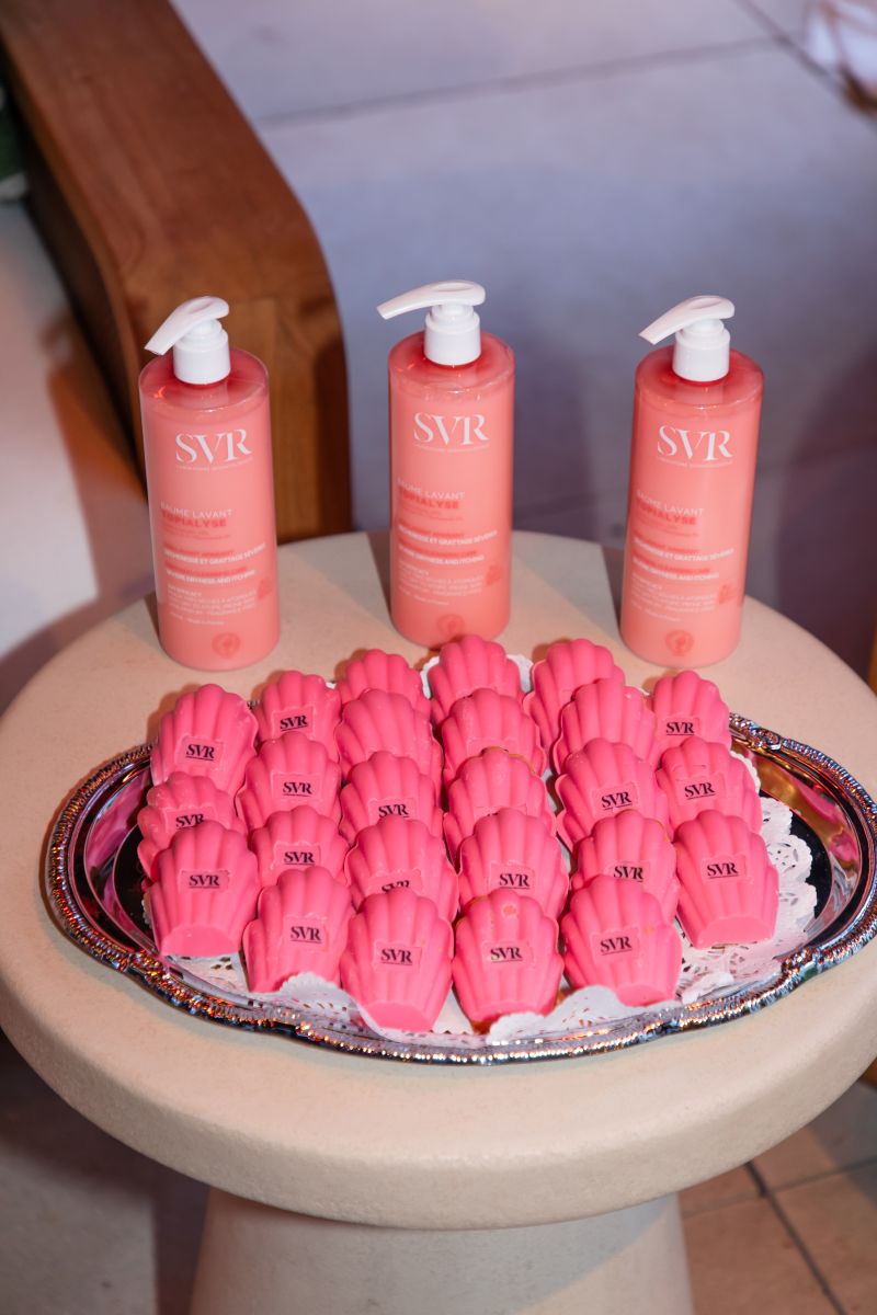 SVR skincare bottles displayed with pink event refreshments