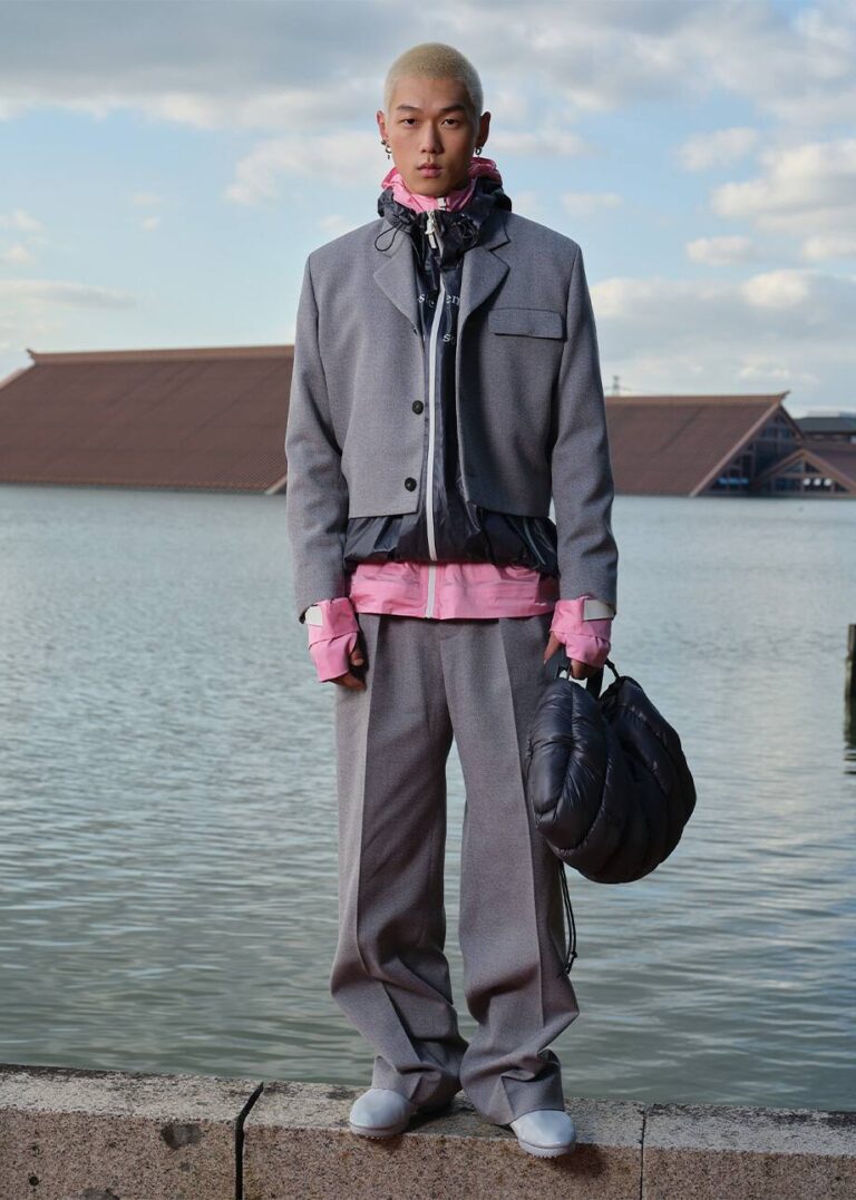 Gray tailoring look beside the water at Lacoste’s Shanghai presentation