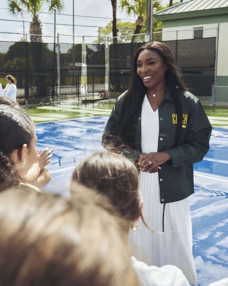 Venus Williams speaking with young tennis participants