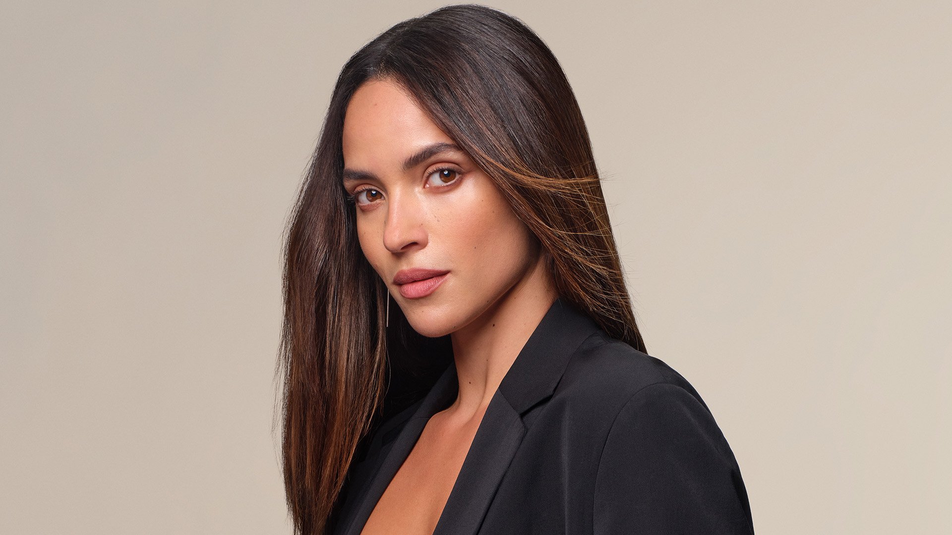 Adria Arjona in a portrait for L’Oréal Paris