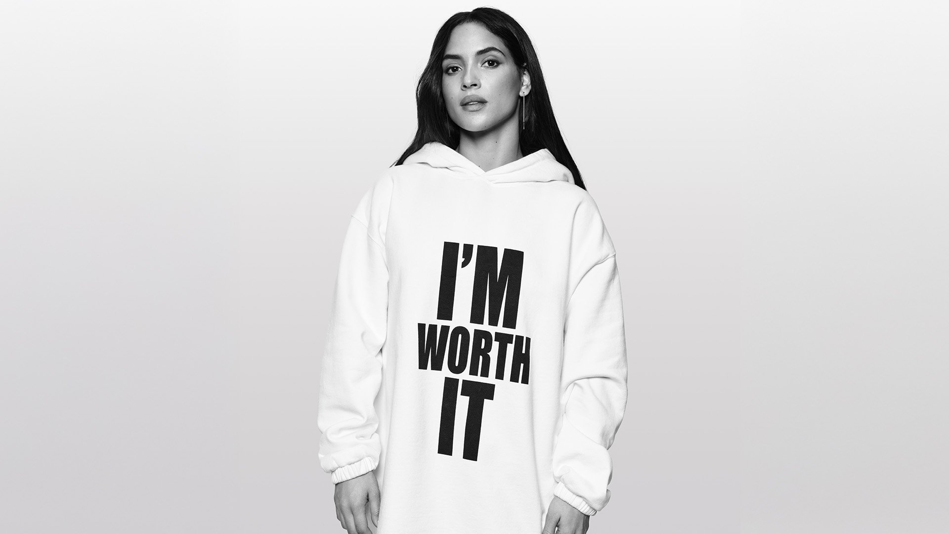 Adria Arjona wearing an I’m Worth It shirt for L’Oréal Paris