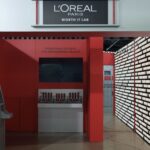 Red-and-silver Worth It Lab installation at the Chemist Warehouse Showcase