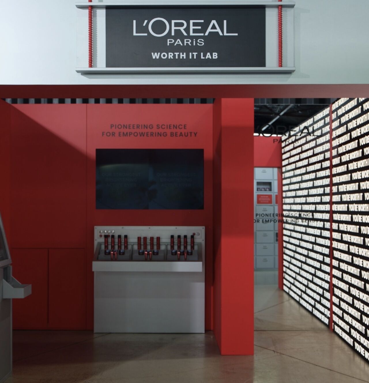 Red-and-silver Worth It Lab installation at the Chemist Warehouse Showcase