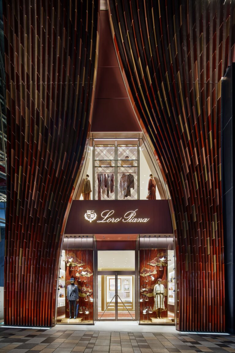 Loro Piana Omotesando flagship entrance framed by curved terracotta tiles