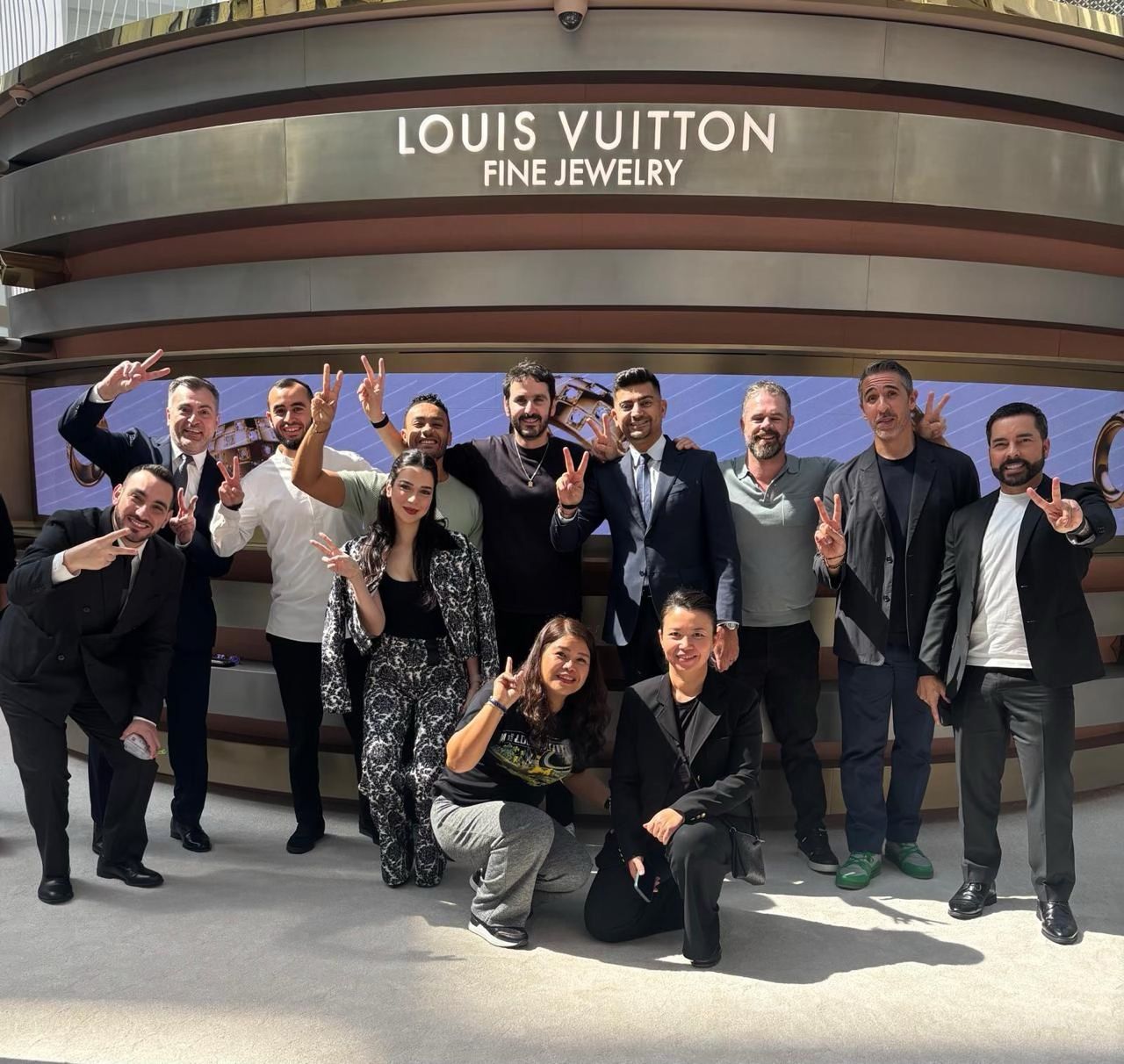 Louis Vuitton jewelry pop-up team in front of the Doha installation