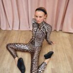 Model wearing a leopard-print GANNI x lululemon jacket and leggings