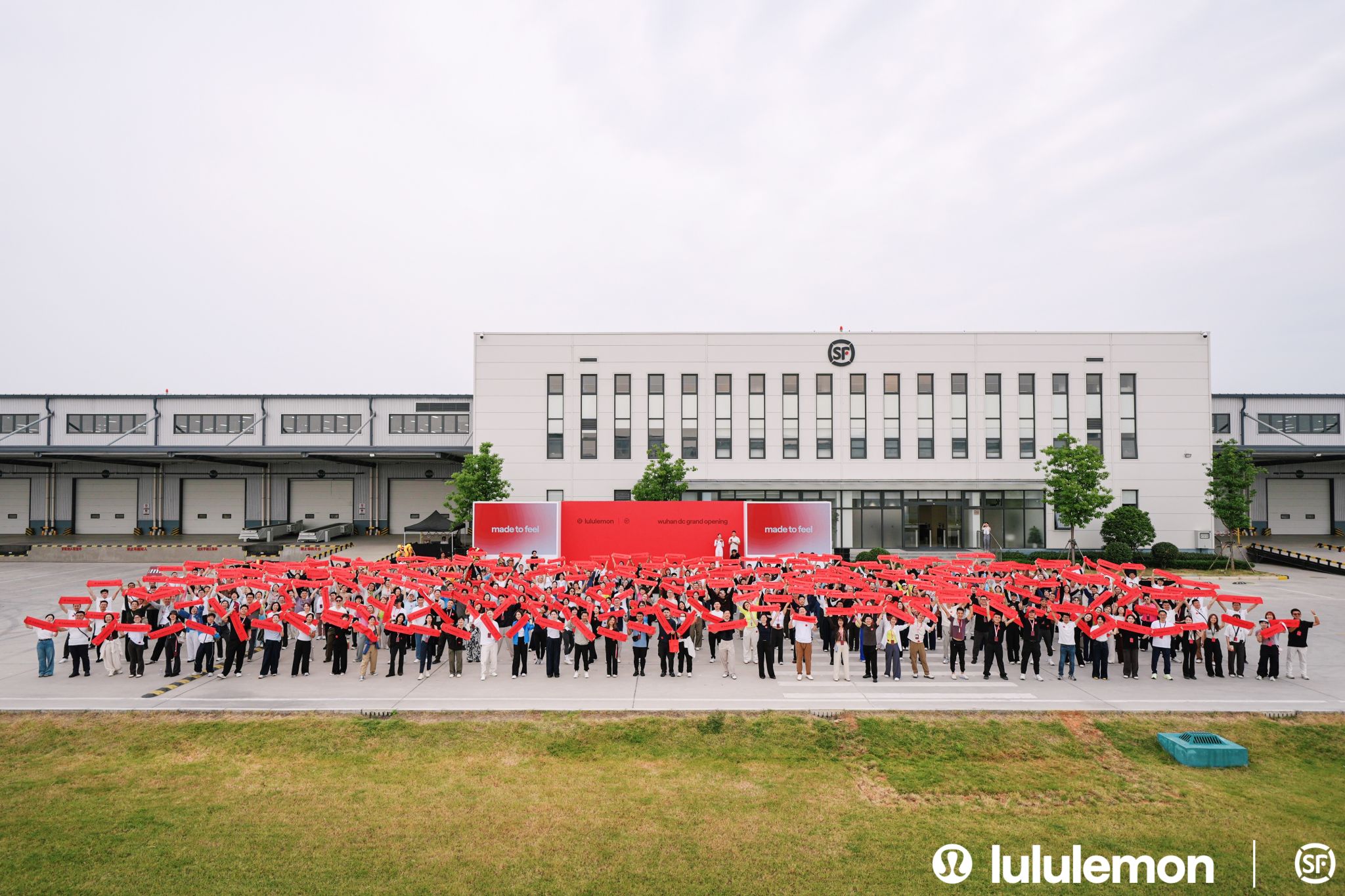 lululemon and S.F. Express teams outside the newly opened Wuhan distribution centre