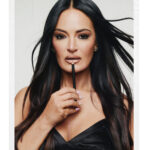 Lisa Barlow holding a lip pencil in her MACzine portrait