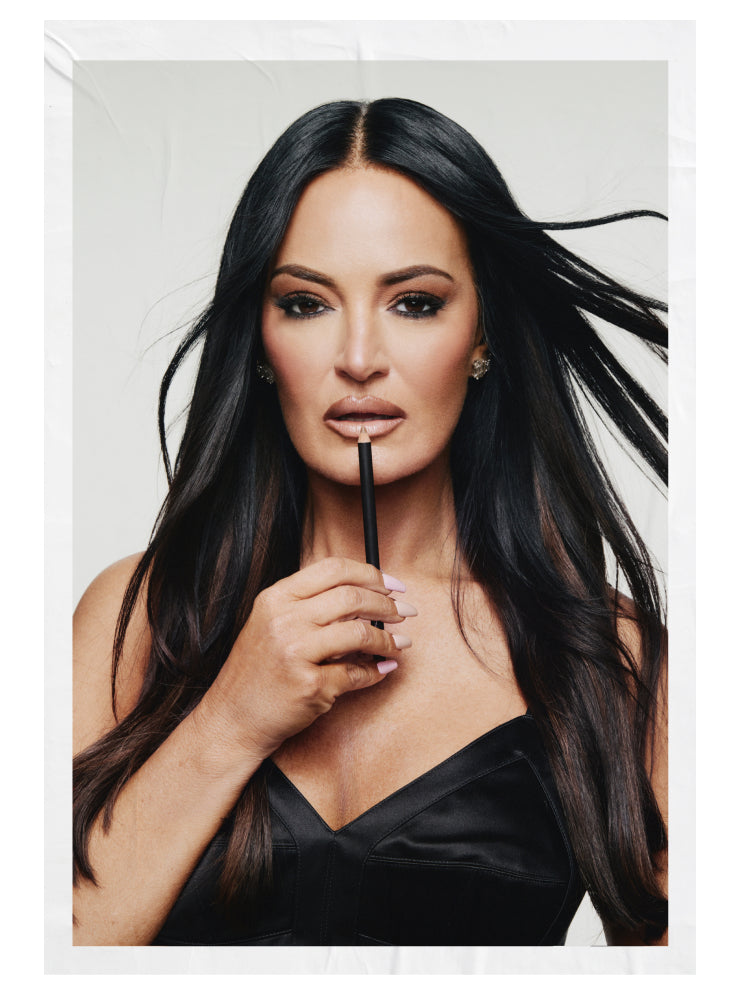 Lisa Barlow holding a lip pencil in her MACzine portrait