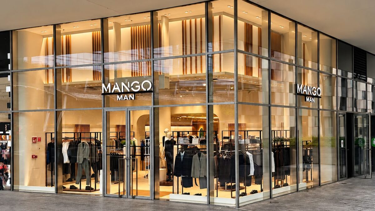 Glass-fronted Mango Man store at Porta Nuova in Milan, with menswear visible inside