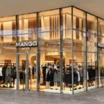 Glass-fronted Mango Man store at Porta Nuova in Milan, with menswear visible inside