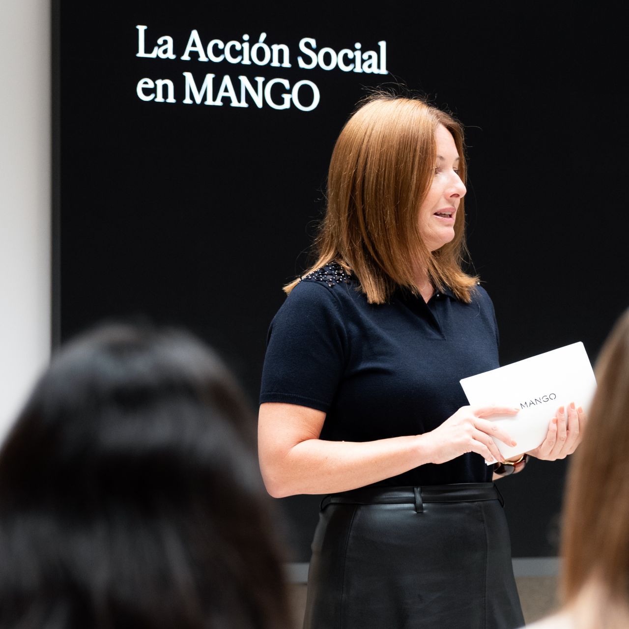 Speaker presenting Mango’s social-action programme