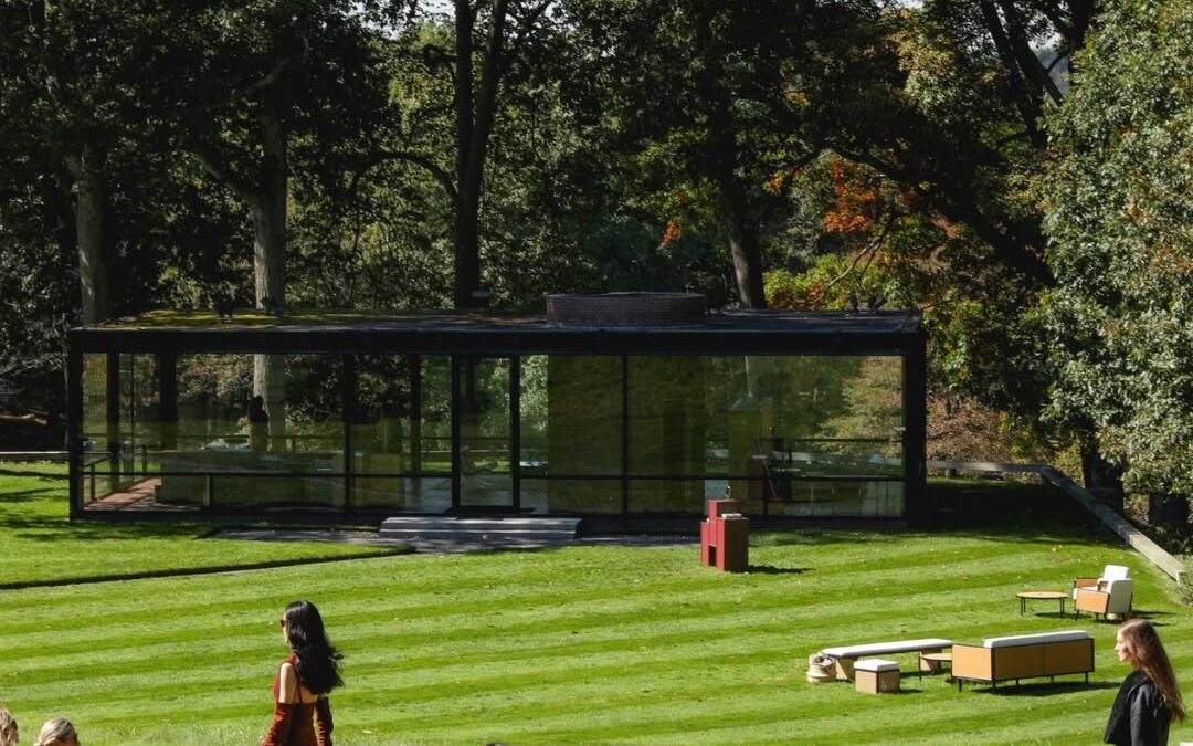 Model walking outdoors near The Glass House during the Max Mara Fall/Winter 2026 presentation