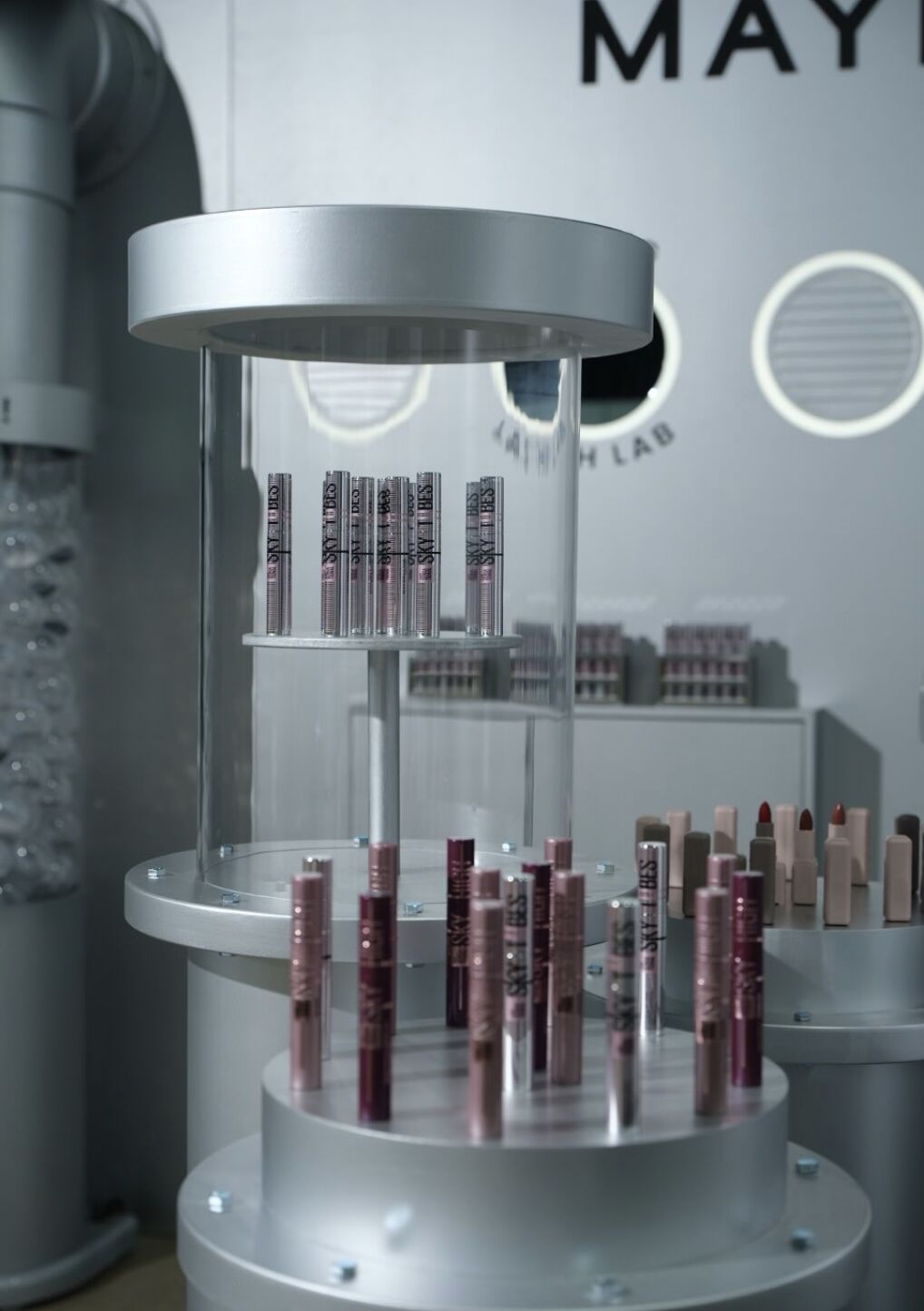 Sky Tubes mascara displayed in a clear cylindrical case at the Maybelline Tubing Lash Lab