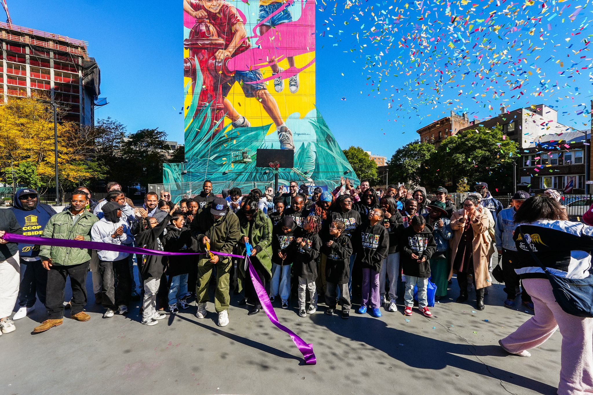Ribbon-cutting celebration for the Morrisania Air Rights mural