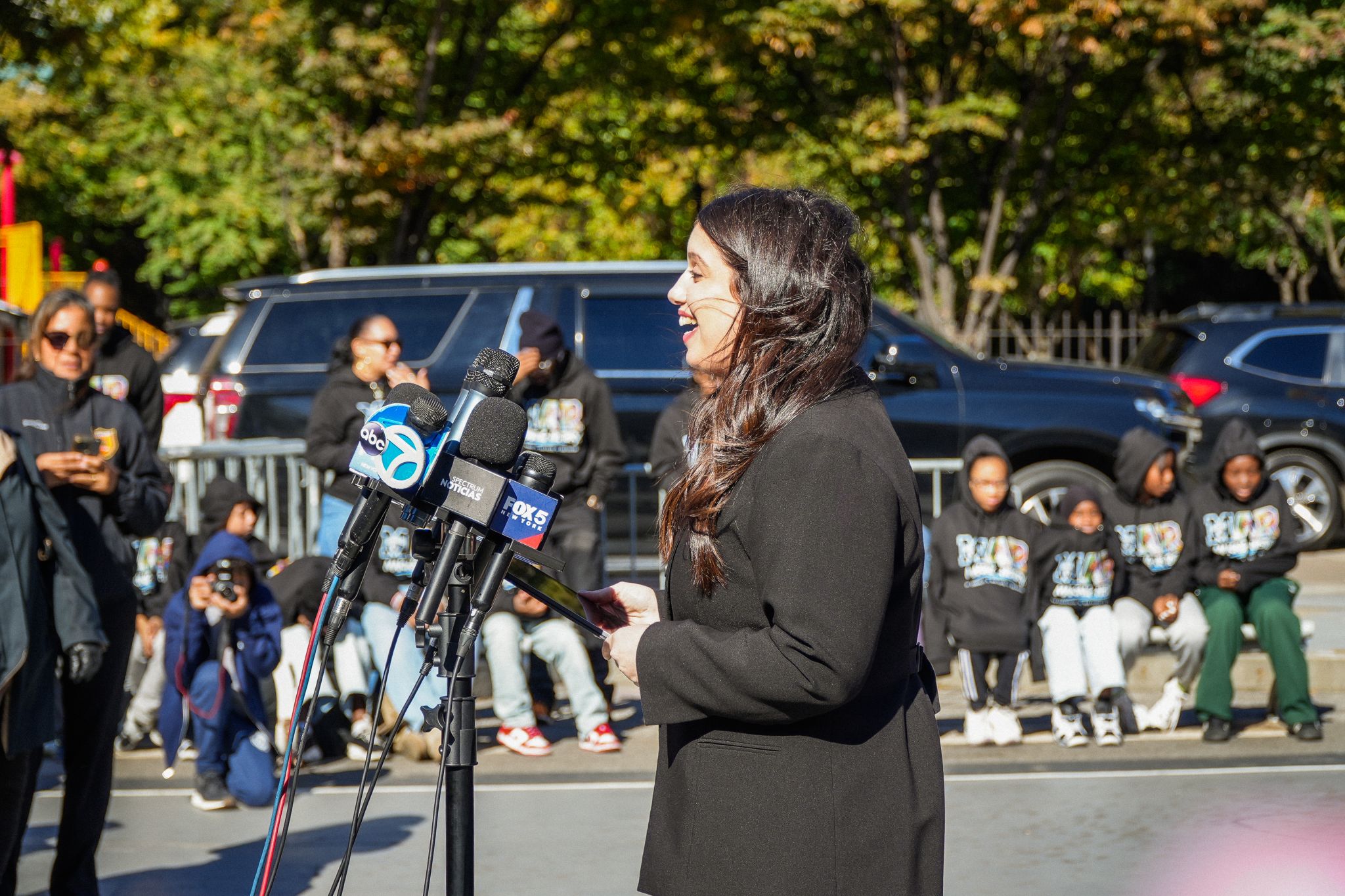 A speaker addressing the mural launch gathering