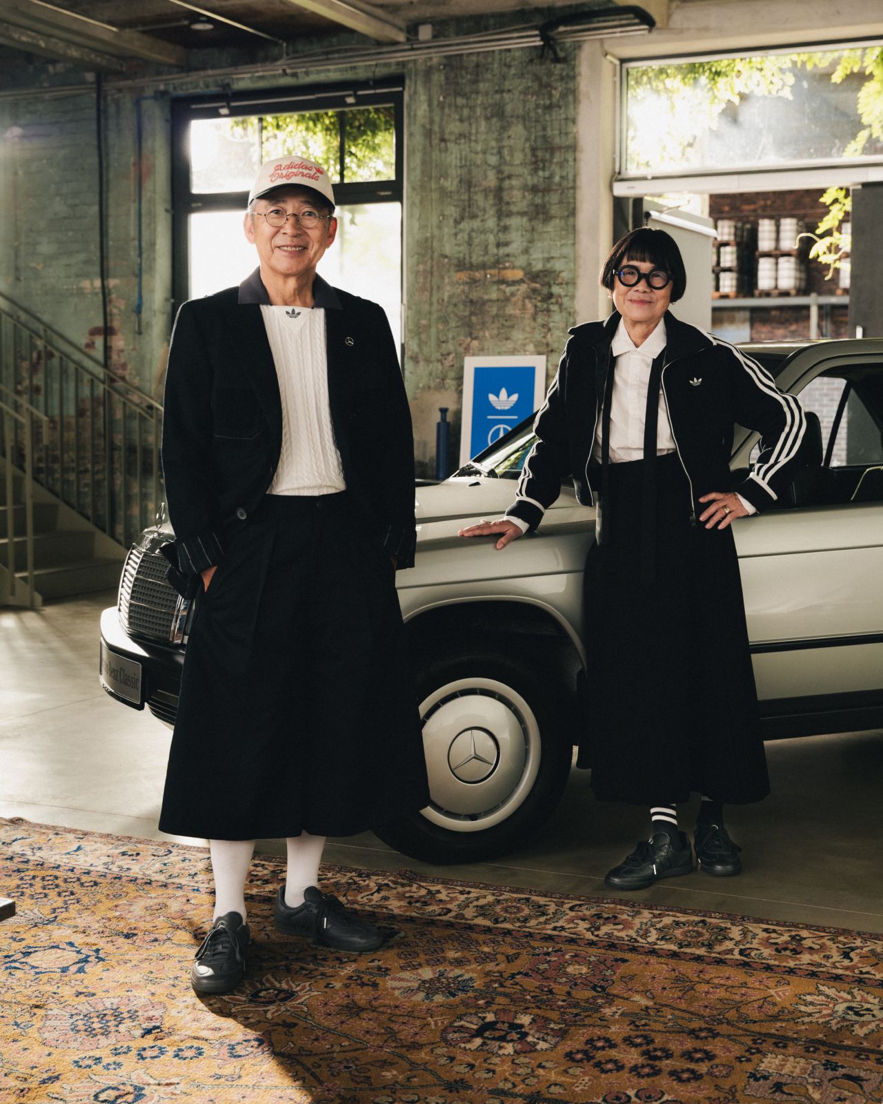 Campaign models beside a Mercedes-Benz vehicle