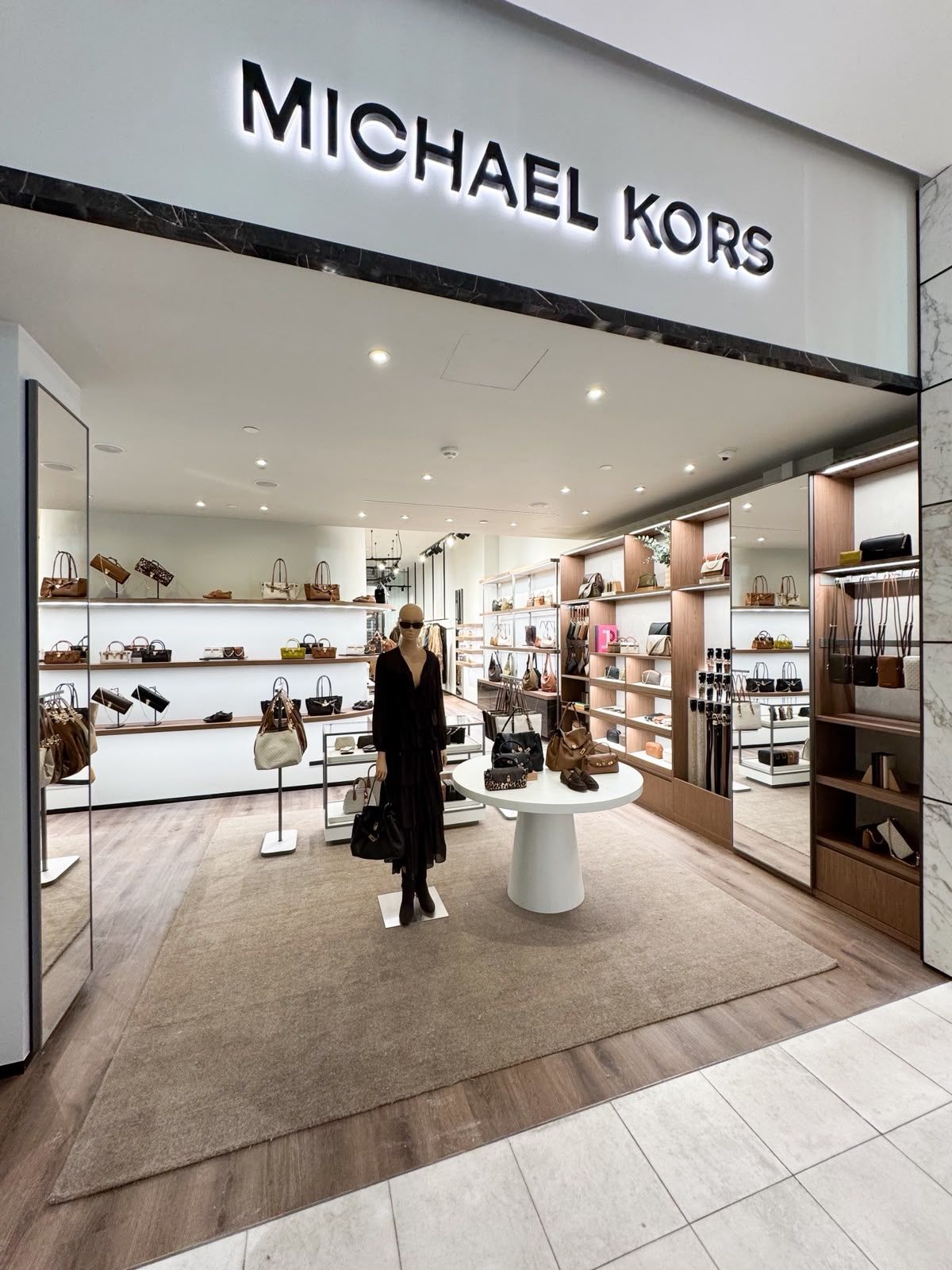 Entrance to the Michael Kors shop-in-shop at ILLUM