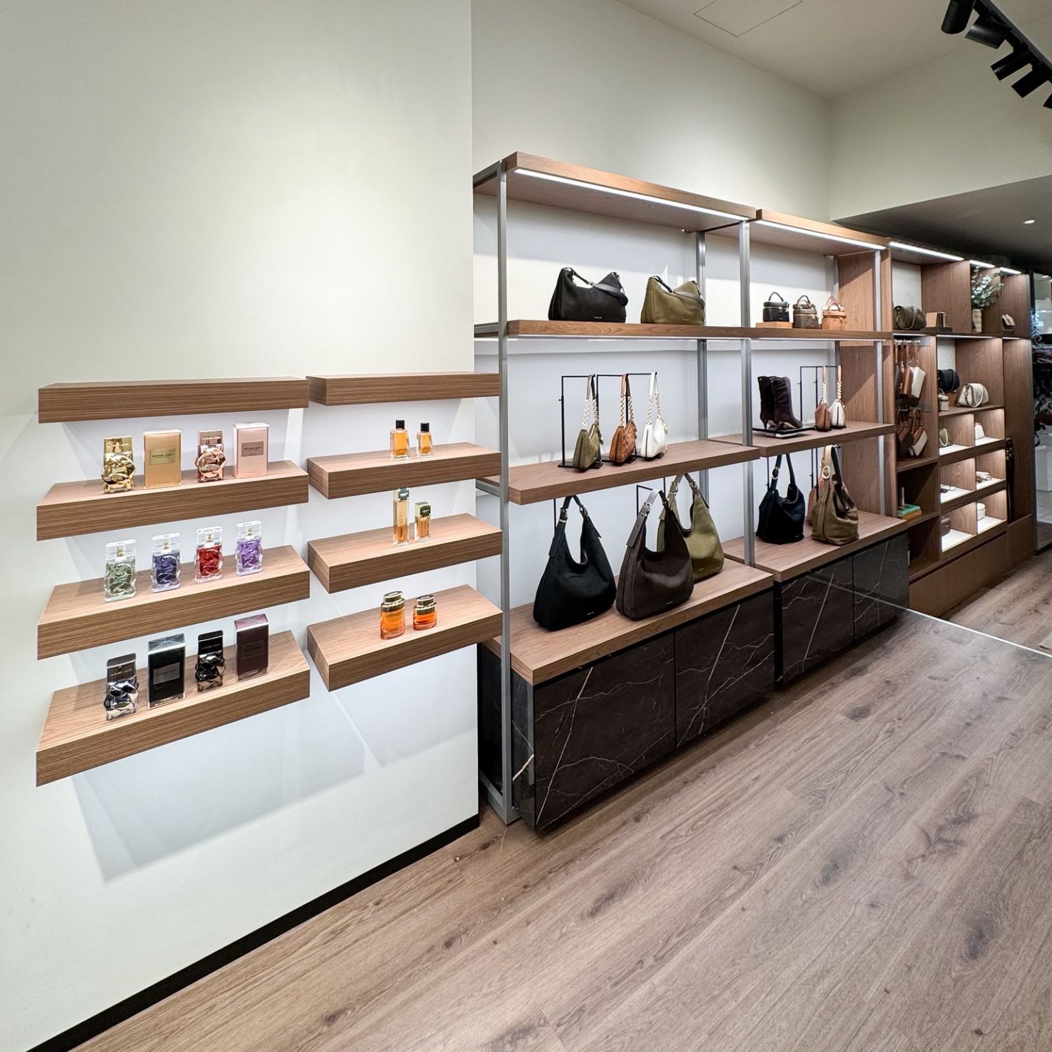 Handbag and fragrance display in the Michael Kors shop-in-shop