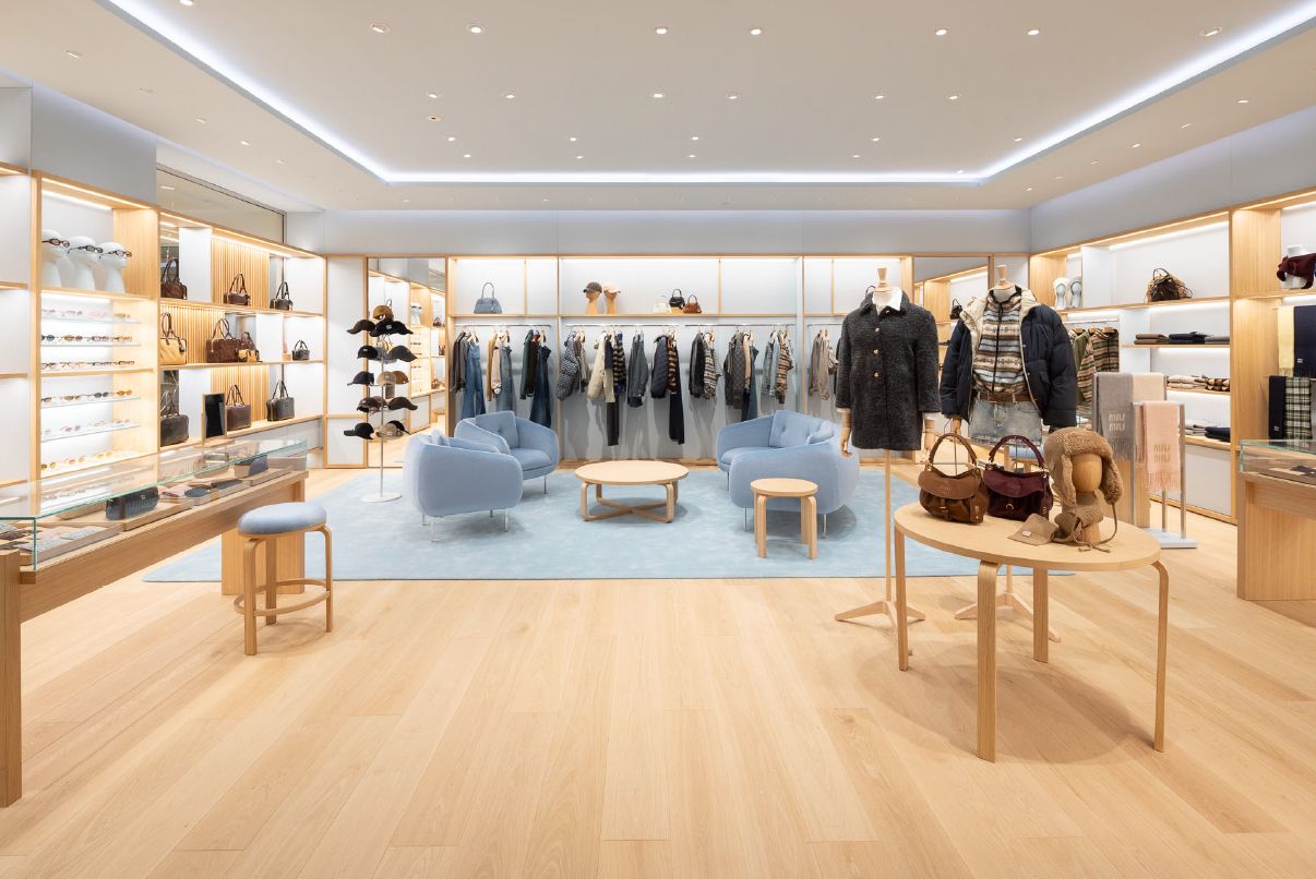 Ready-to-wear and accessory displays inside Miu Miu Boston