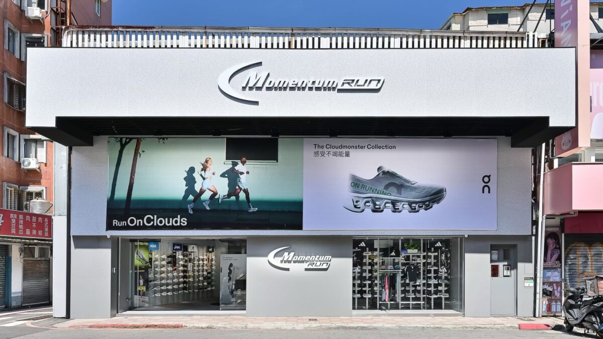 Exterior of the Momentum Run specialty store in Taiwan, with running-shoe displays visible through the windows