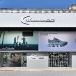 Exterior of the Momentum Run specialty store in Taiwan, with running-shoe displays visible through the windows