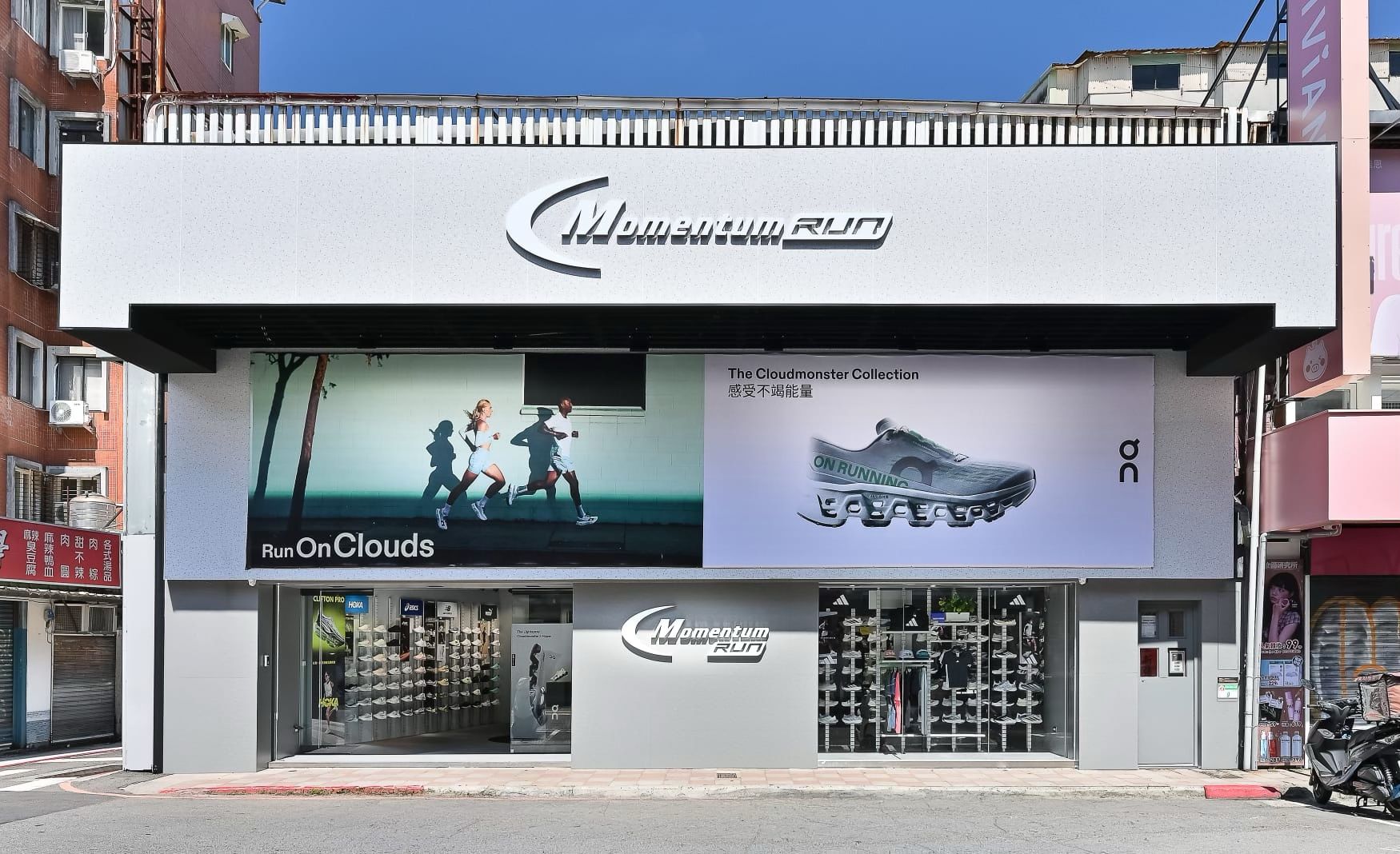 Exterior of the Momentum Run specialty store in Taiwan, with running-shoe displays visible through the windows