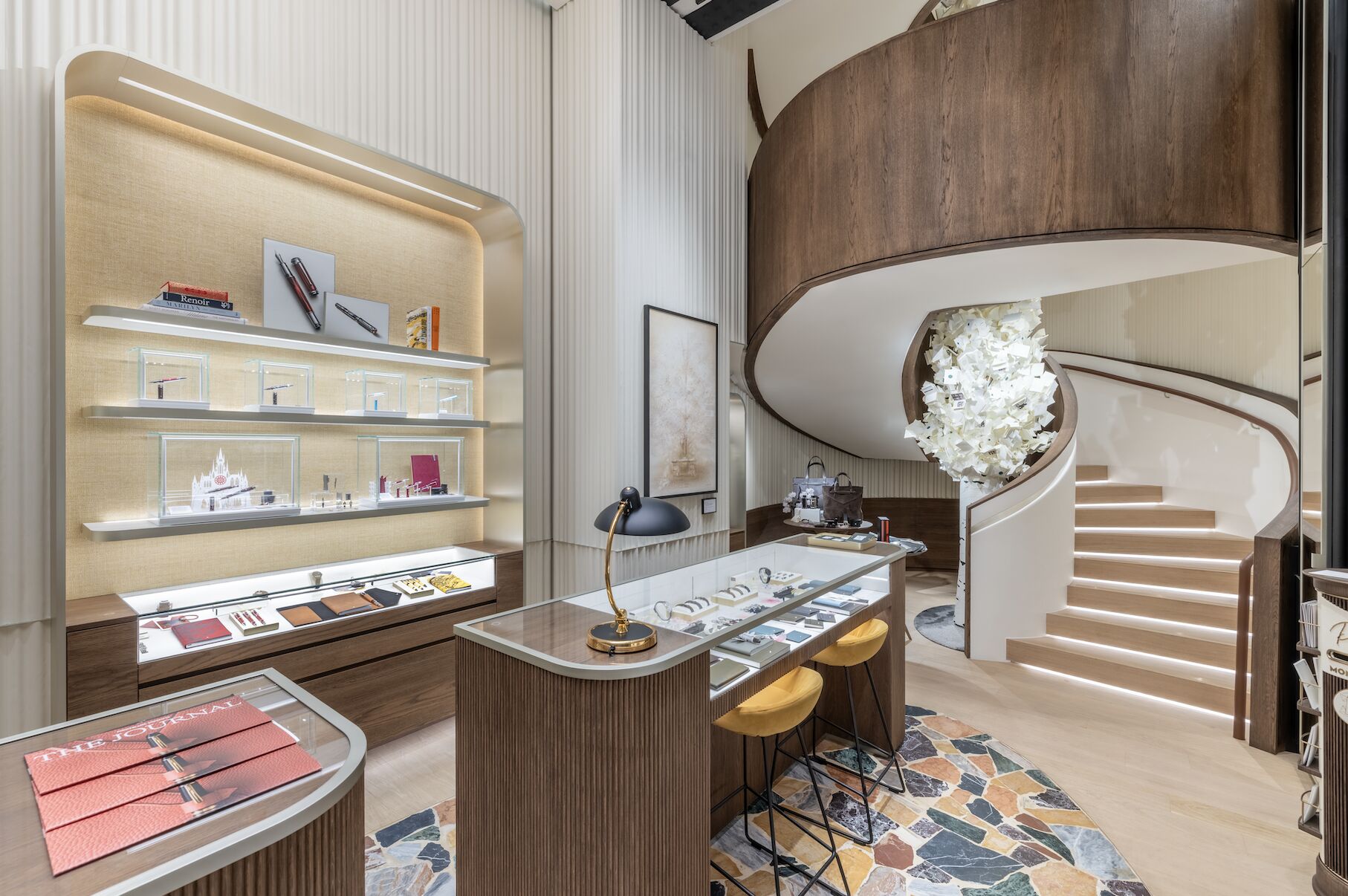 Montblanc display counter beside a curved staircase