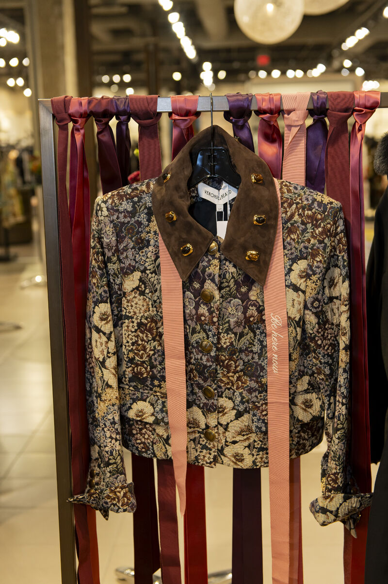 Personalized Veronica Beard blazer displayed with ribbons during the client event