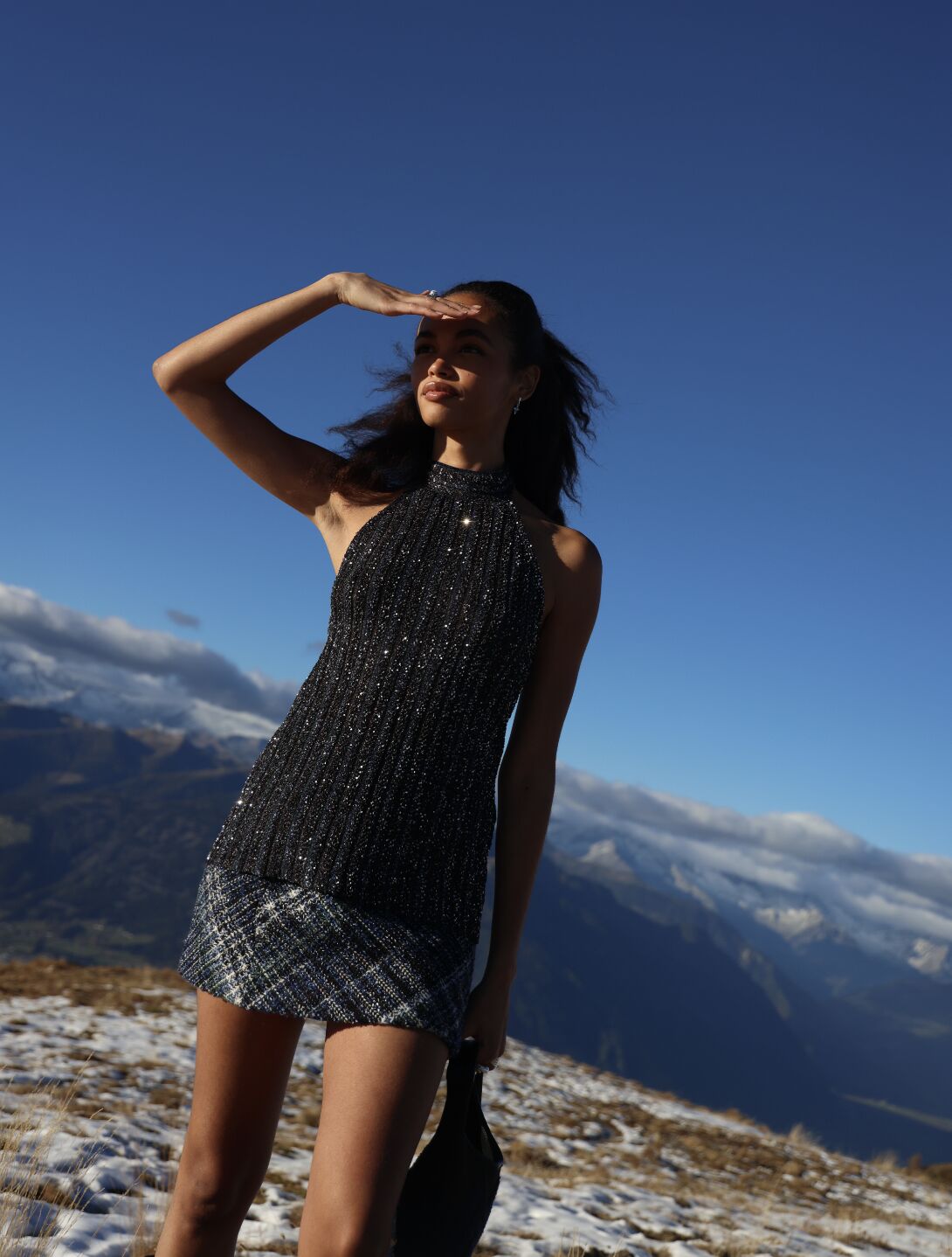 Guest in a patterned dress overlooking the mountains